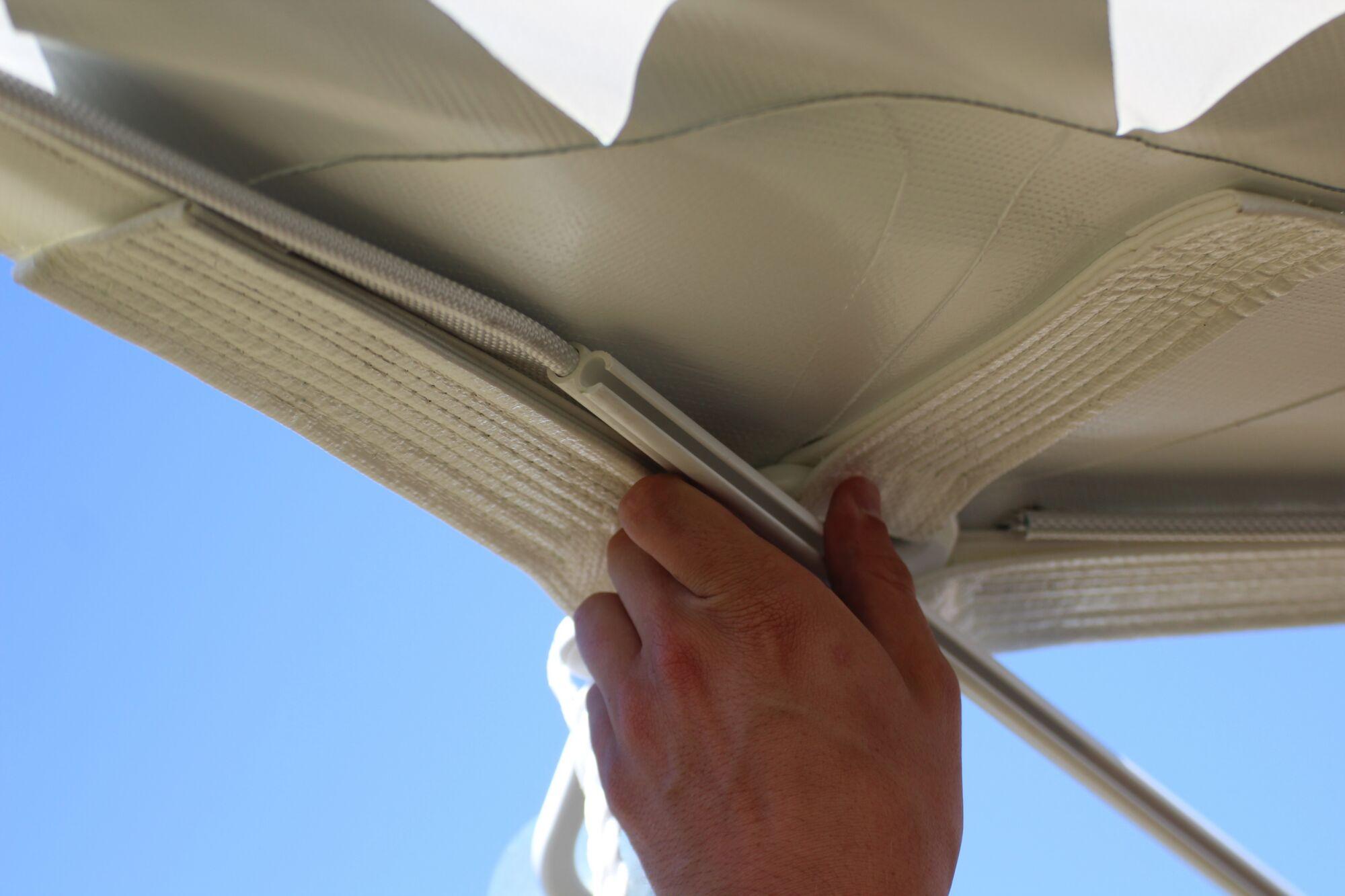 Sailcloth rail for sidewall